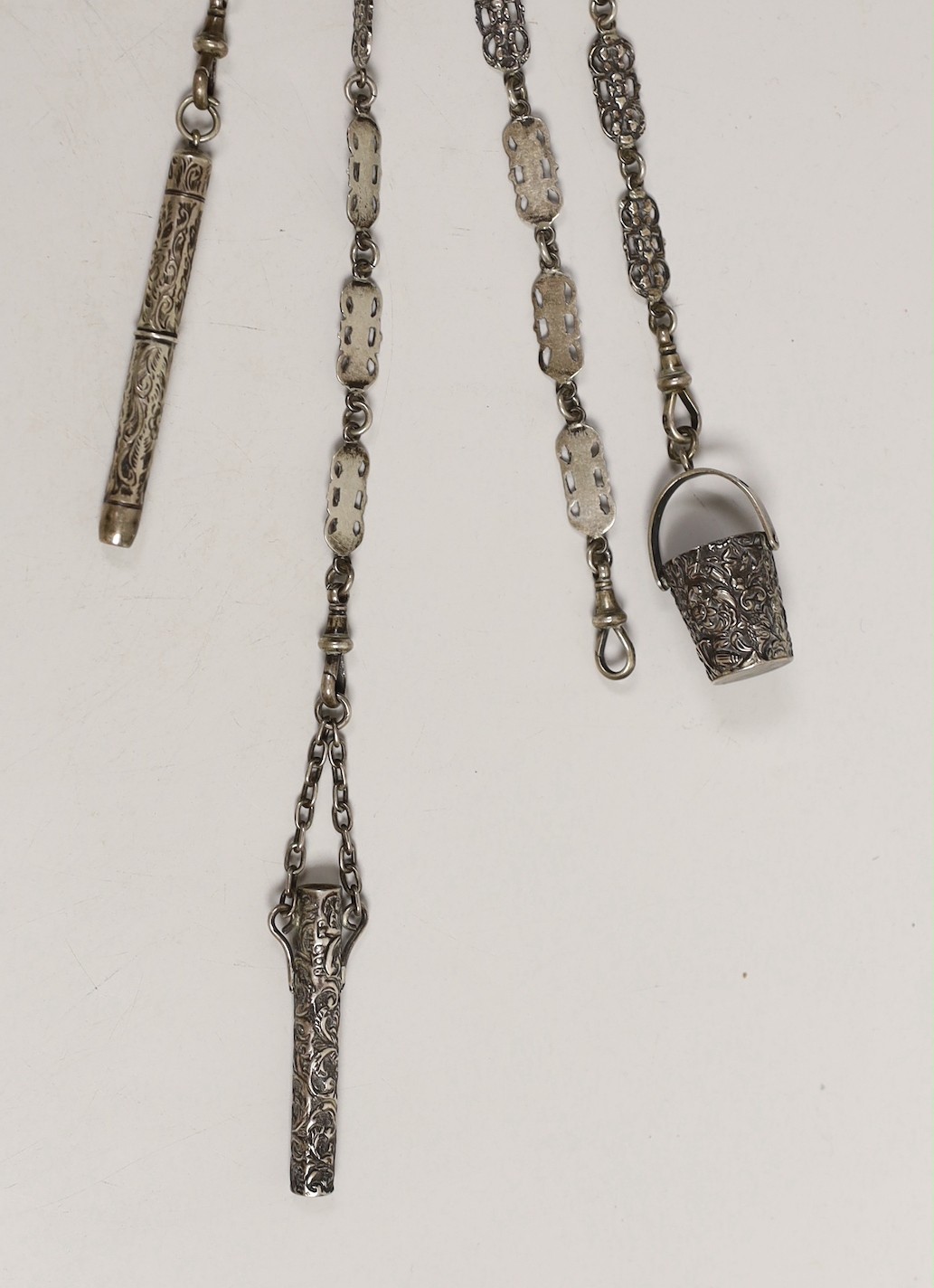 A Victorian silver chatelaine with three (ex 4) accessories, Miller Brothers, London, 1889, 29.2cm.
